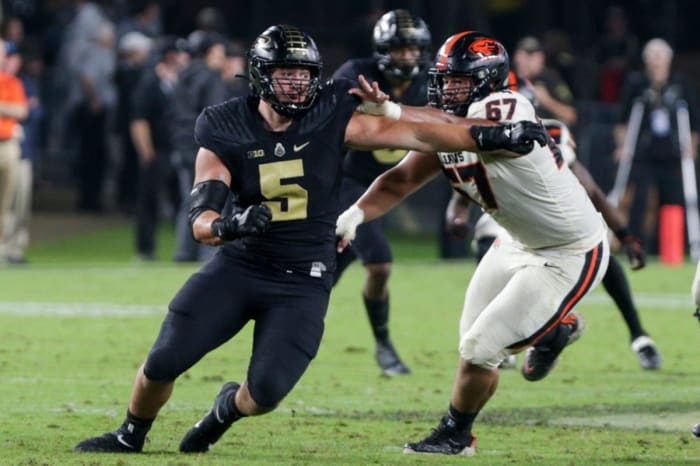Purdue DE George Karlaftis rushes off edge